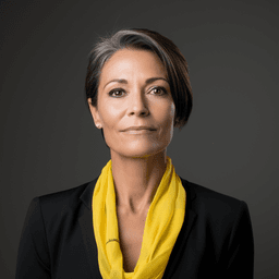 An older woman in a black suit and yellow scarf, in the style of contemporary portrait photography, danish design, uhd image, sterling silver highlights, colorful portraiture, fine line details, light gray